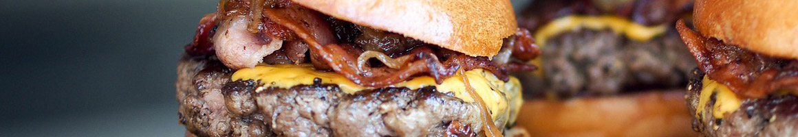 Eating American (Traditional) Burger at Sesame Burgers & Beer restaurant in North Charleston, SC.